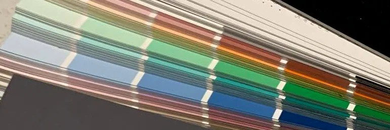 Paint chips fanned out, bands of colour running across