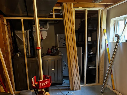 Basement framed up mid build with insulation going in