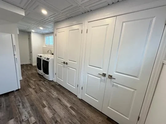 A run of fitted panelled doors with matching casing